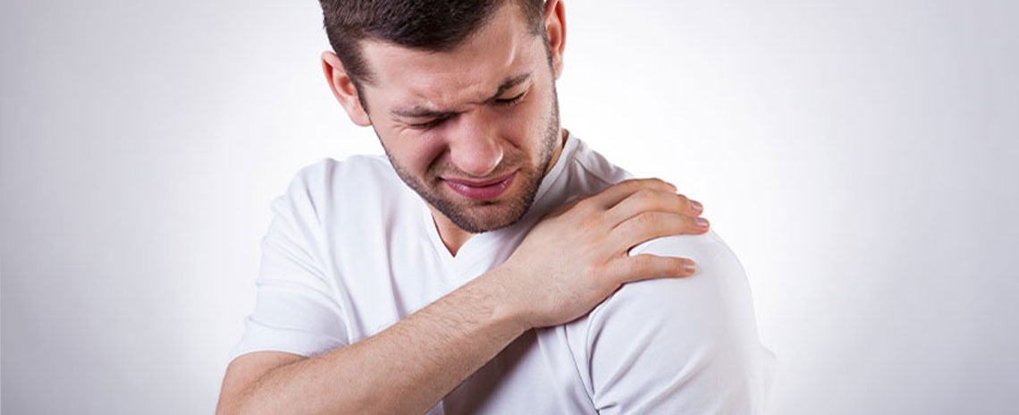Man suffering with frozen shoulder in need of a chiropractic adjustment at Allen Auto Accident Injury Care in Allen