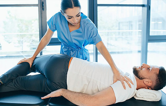 Male patient receiving chiropractic treatment for sciatica at Allen Auto Accident Injury Care in Allen