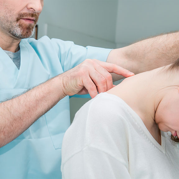 Patient receiving chiropractic consultation for whiplash at Allen Auto Accident Injury Care in Allen